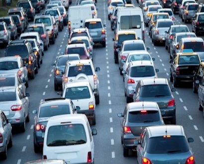 Cars in rush hour with traffic at dawn
